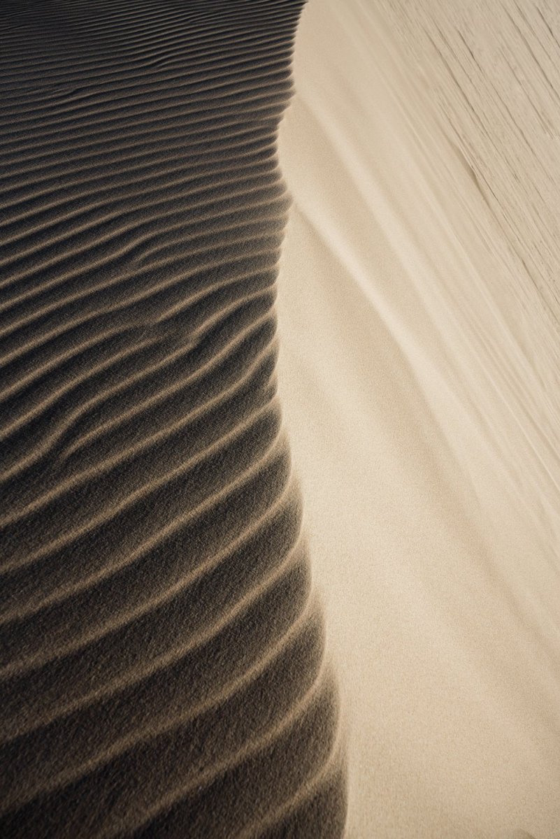 Natural lines of sand blown from wind on dunes