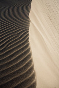 Natural lines of sand blown from wind on dunes