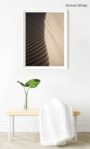 Natural lines of sand blown from wind on dunes in a white fine art frame