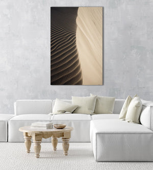 Natural lines of sand blown from wind on dunes in an acrylic/perspex frame
