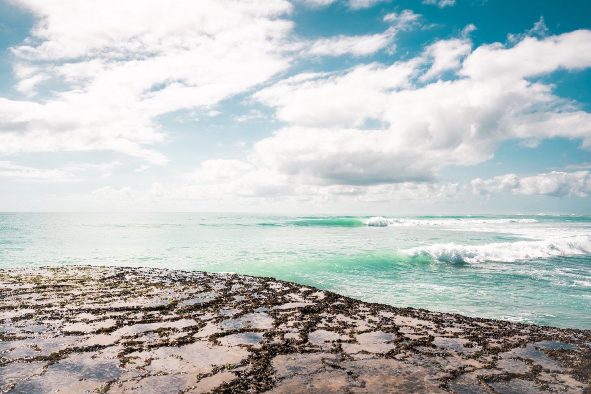 Turquoise waves breaking along arniston coast south africa