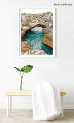 Turquoise water flowing through rock arch in arniston south africa in a white fine art frame