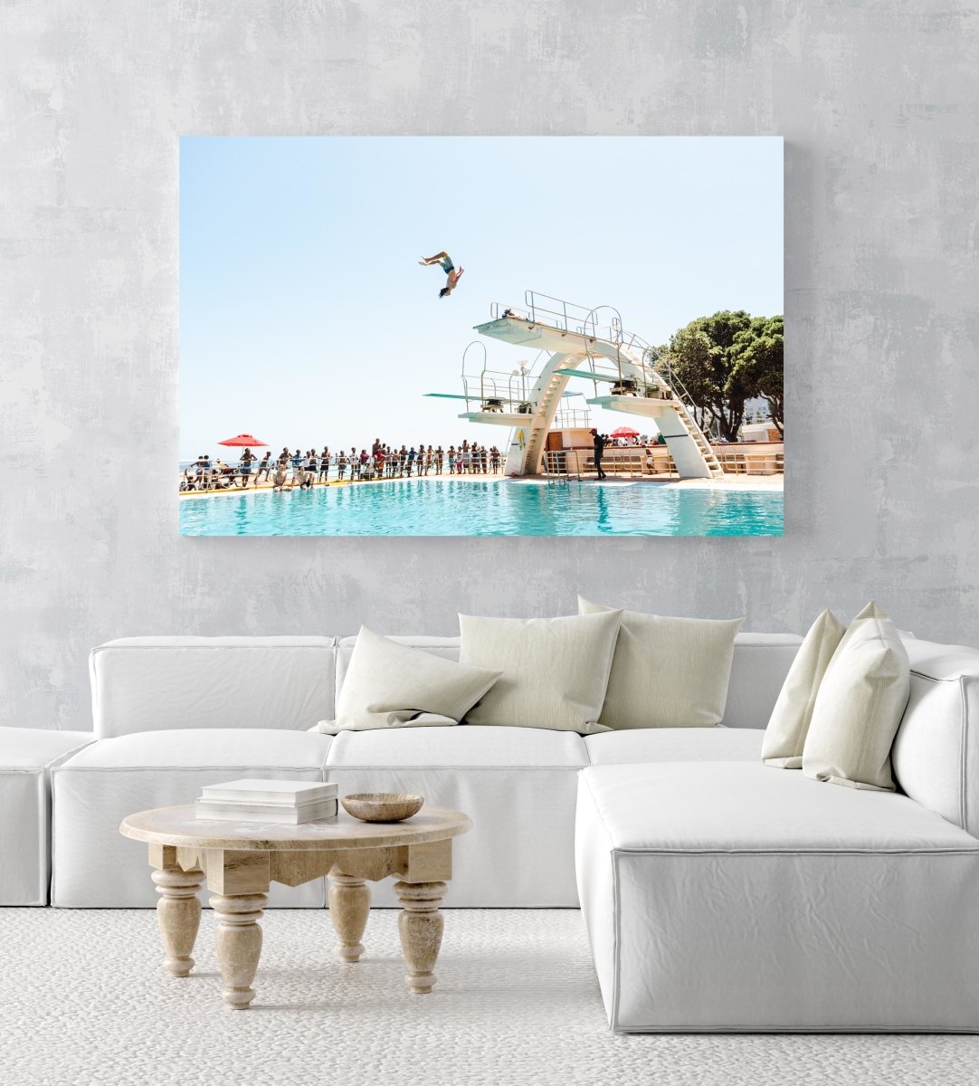 Boy doing backflip at blue Sea Point pools in cape town in an acrylic/perspex frame