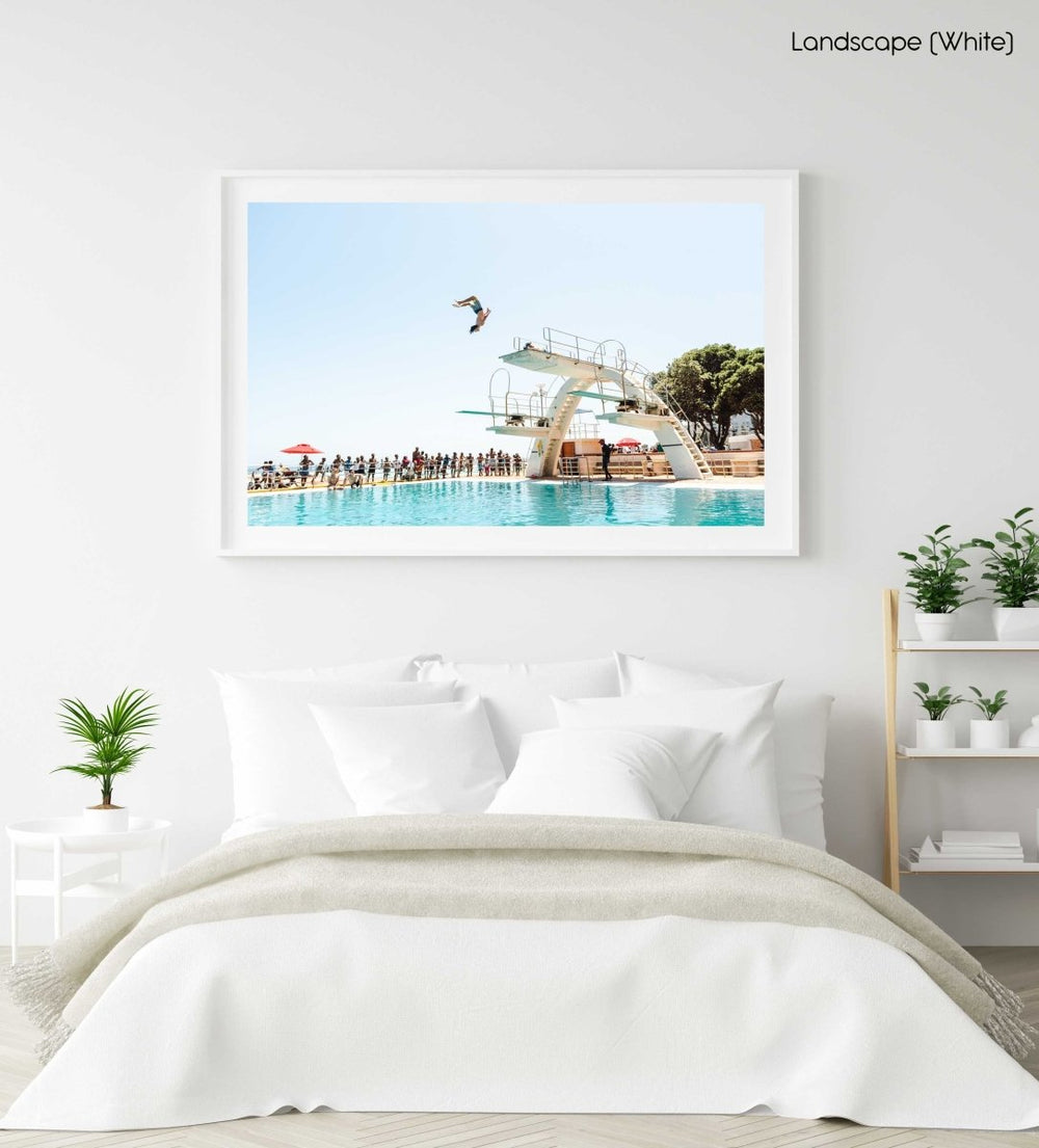 Boy doing backflip at blue Sea Point pools in cape town in a white fine art frame
