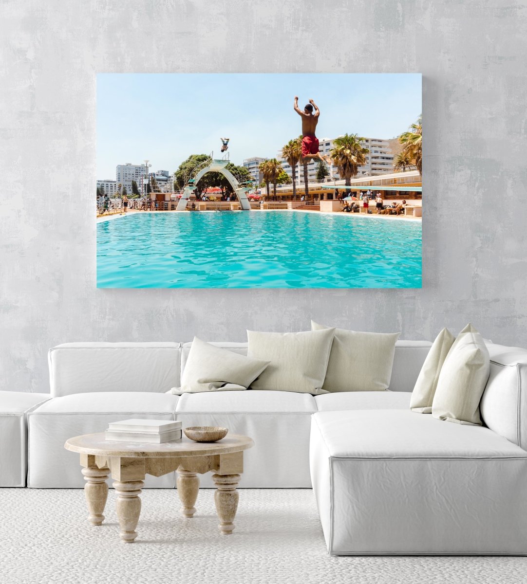 Two boys jumping in sea point pools during summer in cape town in an acrylic/perspex frame