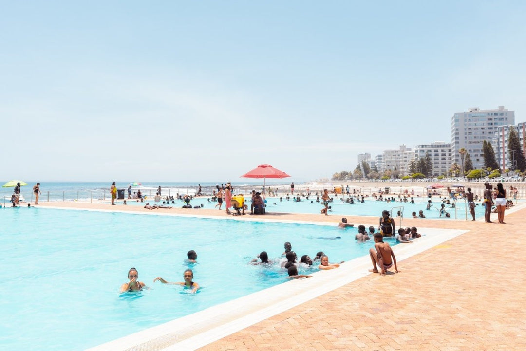 Lots of people in sea point pools on a hot day in cape town