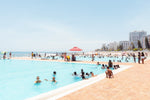 Lots of people in sea point pools on a hot day in cape town