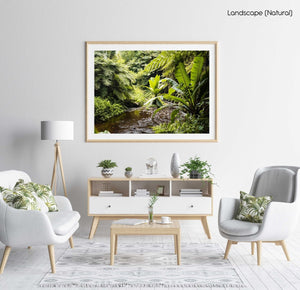 Water flowing down river in a green jungle in Kenya in a natural fine art frame