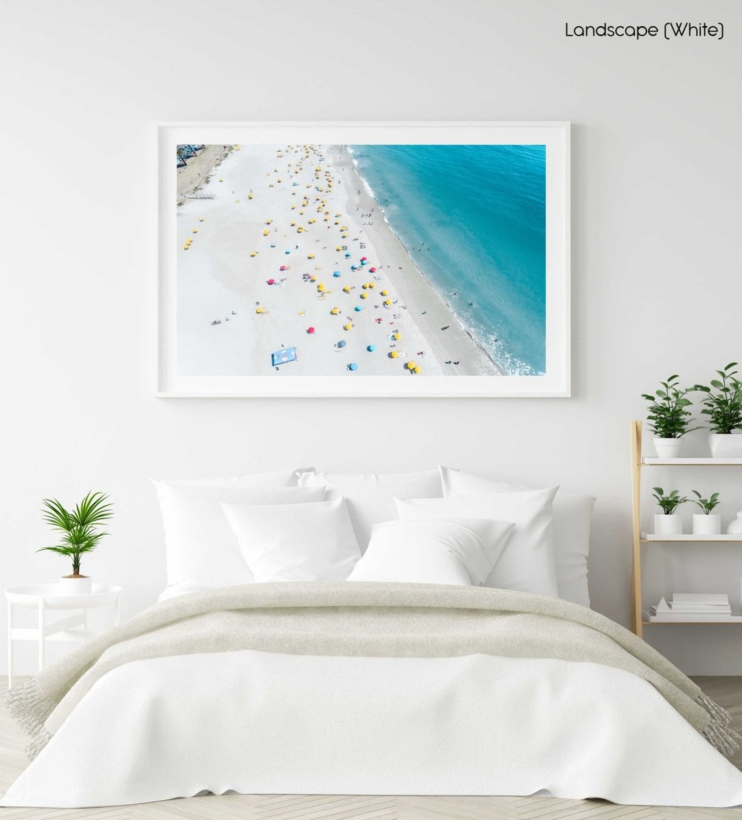 Aerial high above Camps Bay beach with lots of umbrellas and people in a white fine art frame