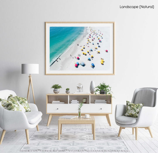 Aerial colorful umbrellas and people in sun on Camps Bay beach Cape Town in a natural fine art frame