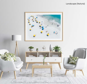 Blue and yellow umbrellas on Camps Bay beach Cape Town from above in a natural fine art frame