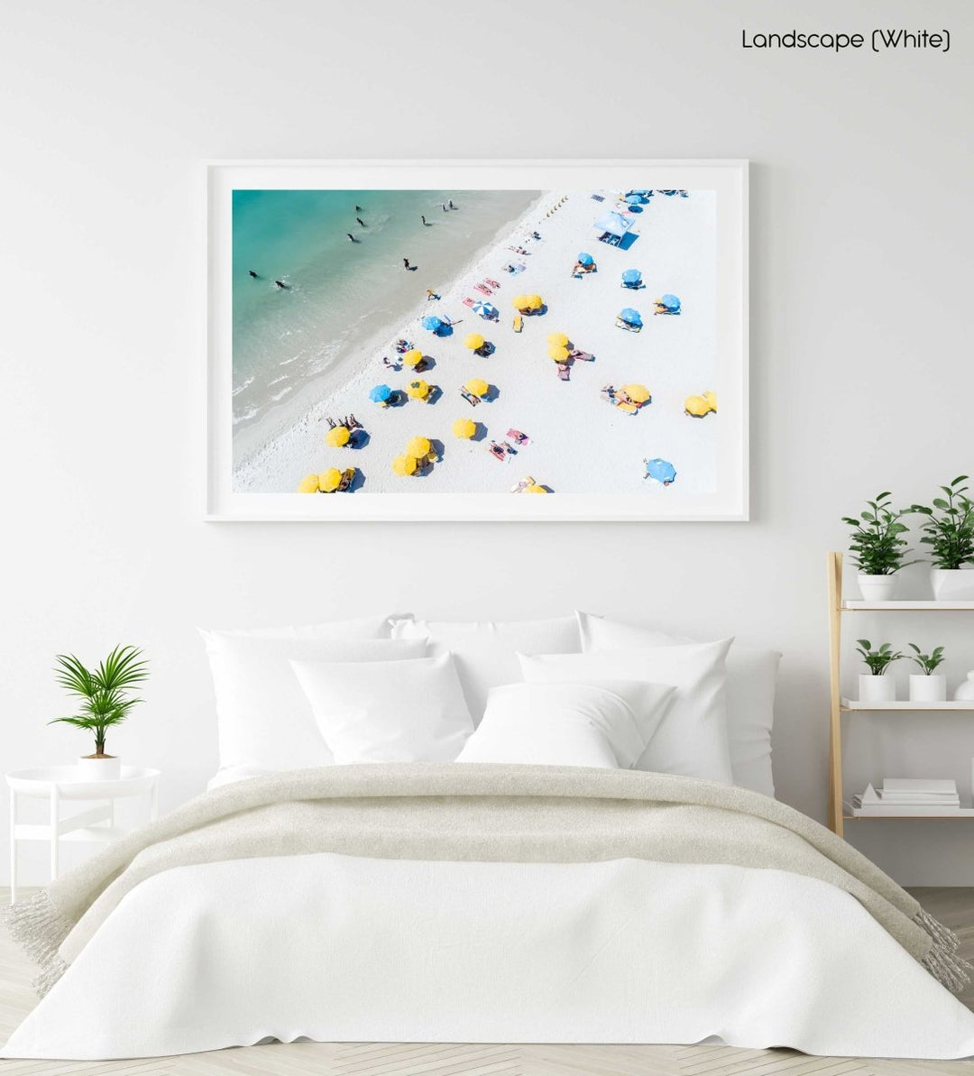 Aerial of green sea and colorful umbrellas from above on Camps Bay beach in a white fine art frame