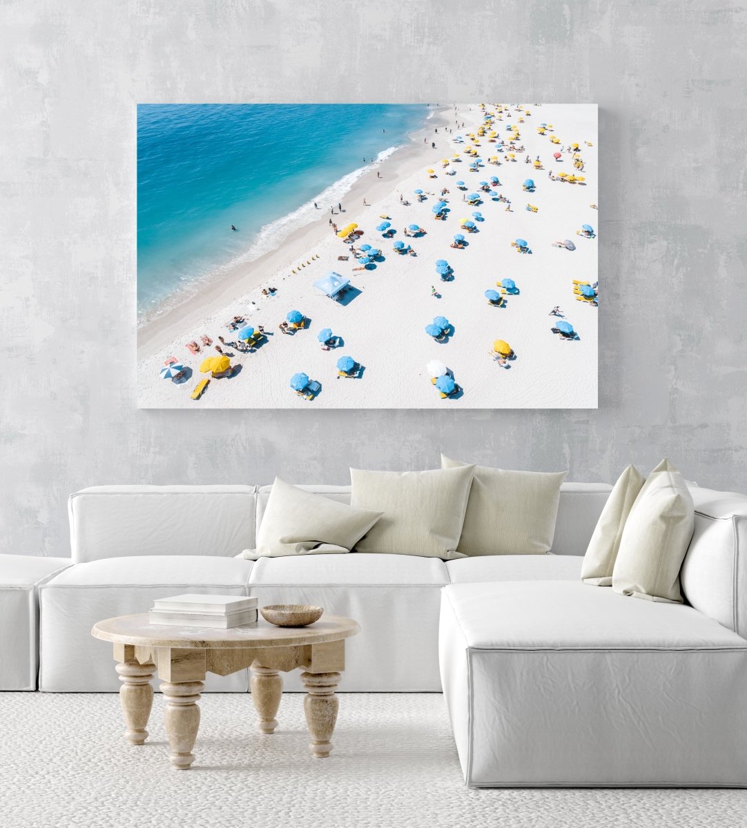Blue and yellow umbrellas from above on summer day in cape town in an acrylic/perspex frame