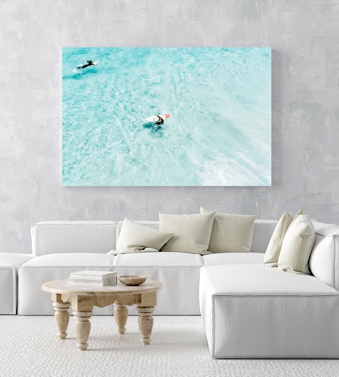 Surfers from above in light blue water in Cape Town in an acrylic/perspex frame