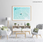 Surfers from above in light blue water in Cape Town in a natural fine art frame