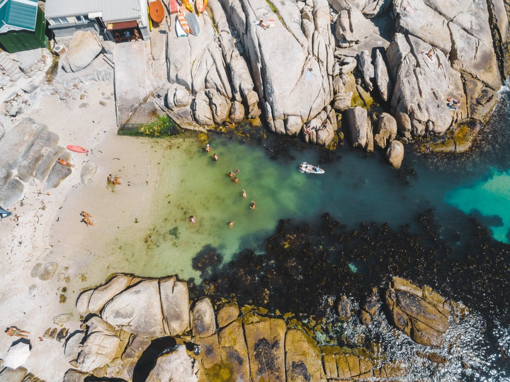 Swimmers from above at Beta Beach in Cape Town