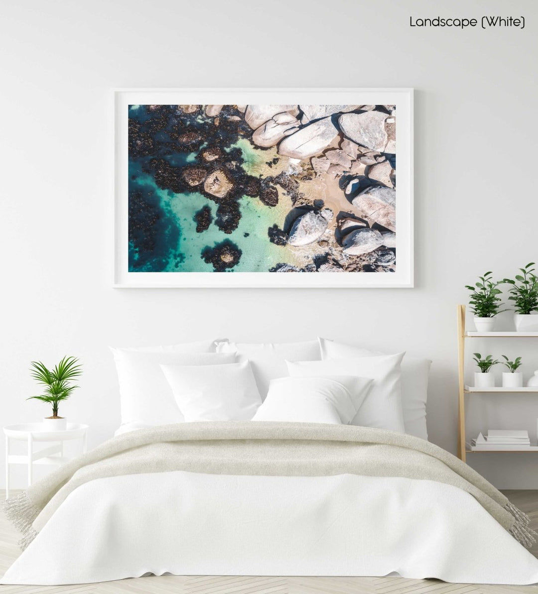 Boulders and people from above at green sea in Oudekraal Cape Town in a white fine art frame