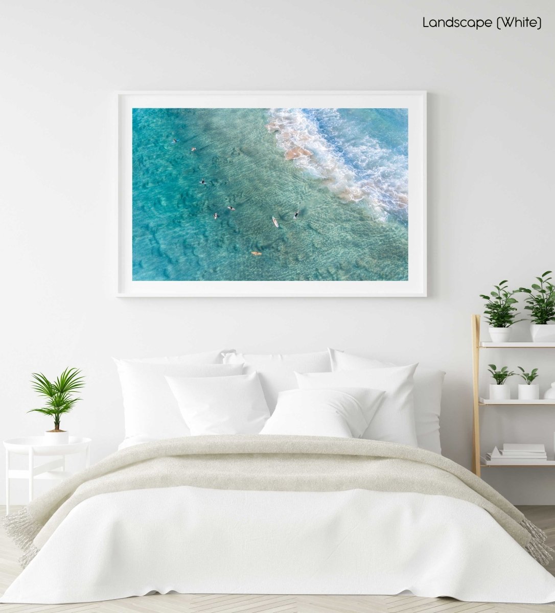 Surfers from above in blue turquoise sea at Manly beach sydney in a white fine art frame