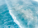 Surfers on whitewash from above in Sydney Australia