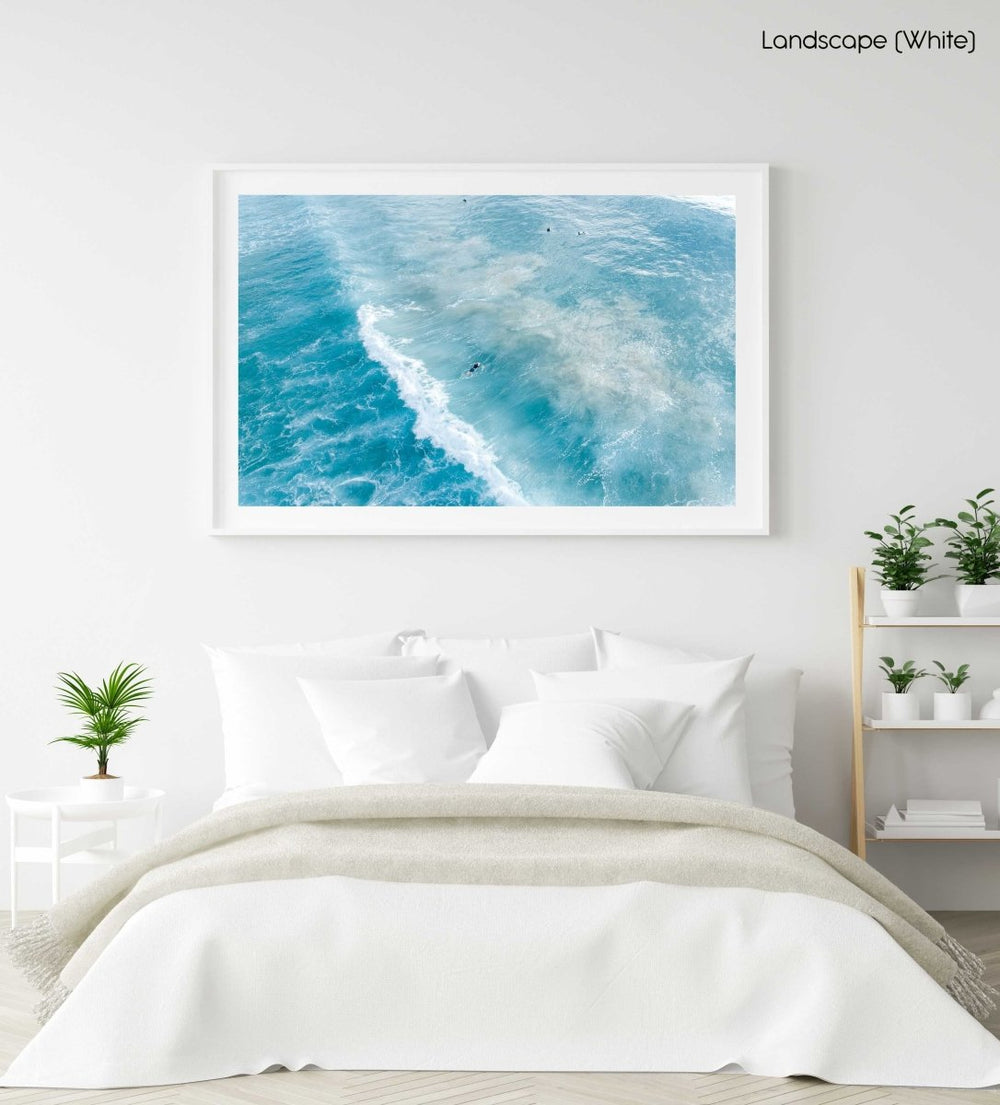 Surfers on whitewash from above in Sydney Australia in a white fine art frame