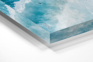 Surfers on whitewash from above in Sydney Australia in an acrylic/perspex frame