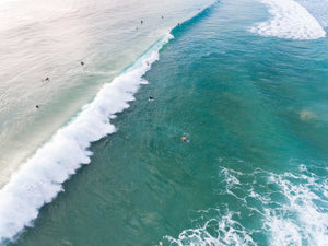 Dark green and blue whitewash rolling through Manly Beach surf