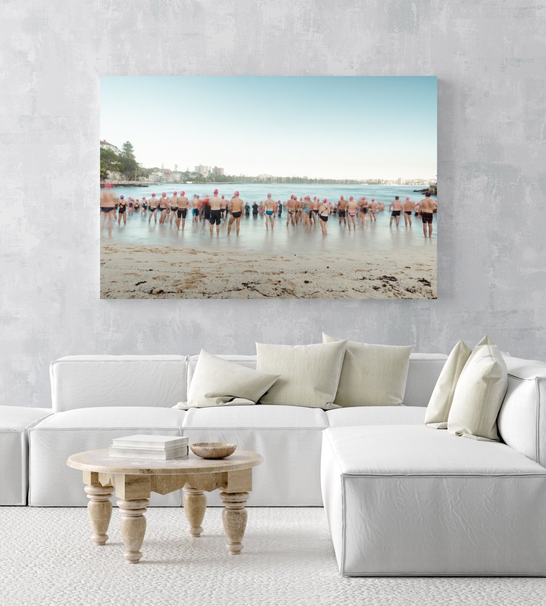 Lots of pink cap swimmers about to get in water at Shelly Beach Sydney in an acrylic/perspex frame