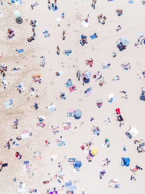 Aerial topdown of people tanning at the beach in Sydney