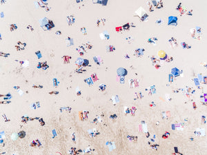 Aerial topdown of people tanning at the beach in Sydney