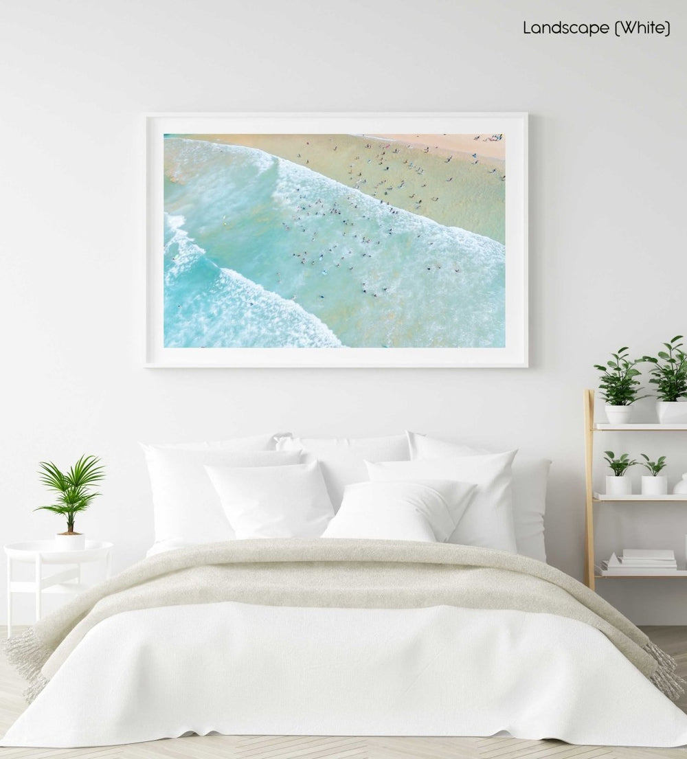 Lots of swimmers in the waves at Manly Beach in Sydney in a white fine art frame