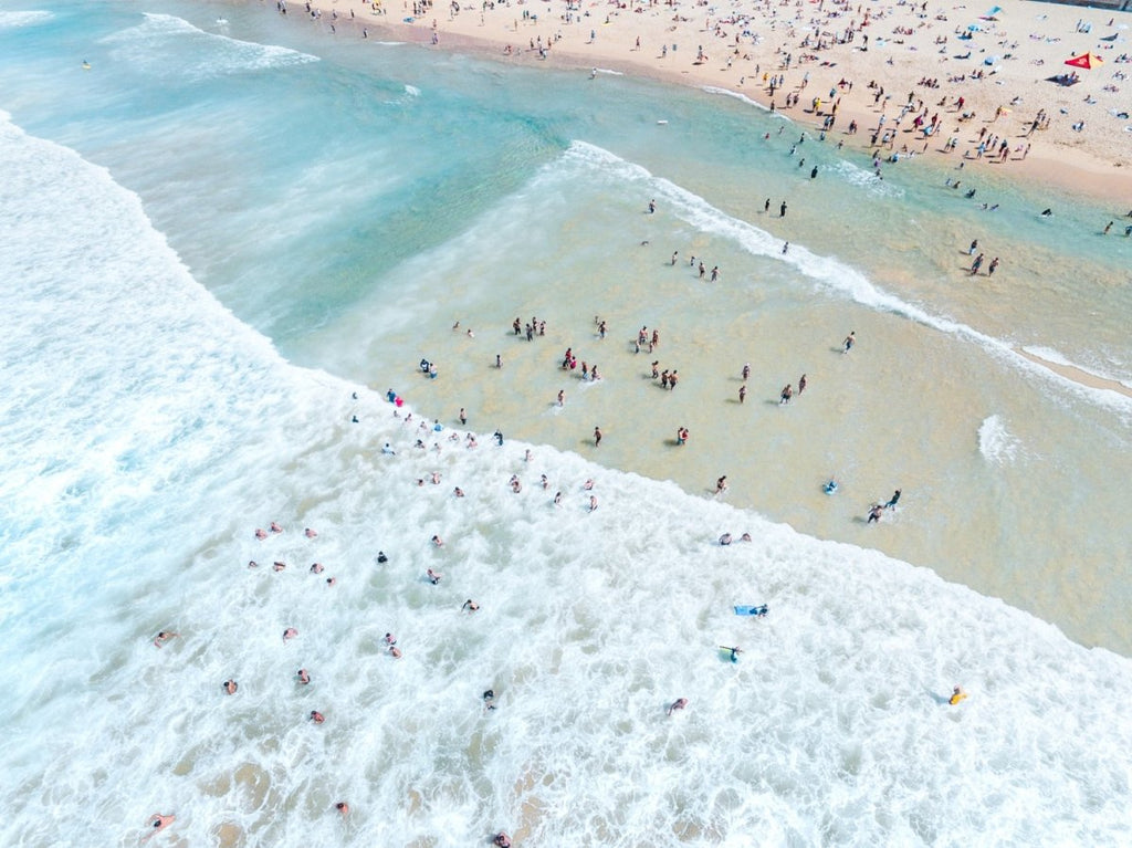 Crowd of swimmers in the waves at Manly Beach in Sydney