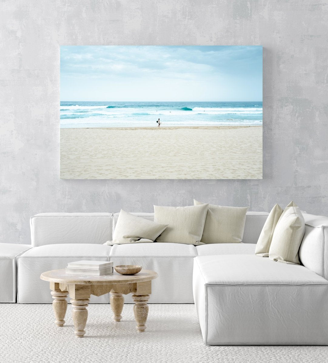 Man with surfboard looking out to blue waves along Manly Beach in Sydney in an acrylic/perspex frame