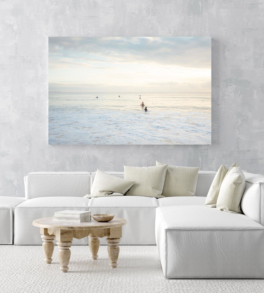 Neutral surfers lined up in water for sunrise surf on Manly Beach Sydney in an acrylic/perspex frame