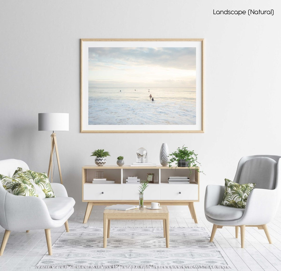 Neutral surfers lined up in water for sunrise surf on Manly Beach Sydney in a natural fine art frame