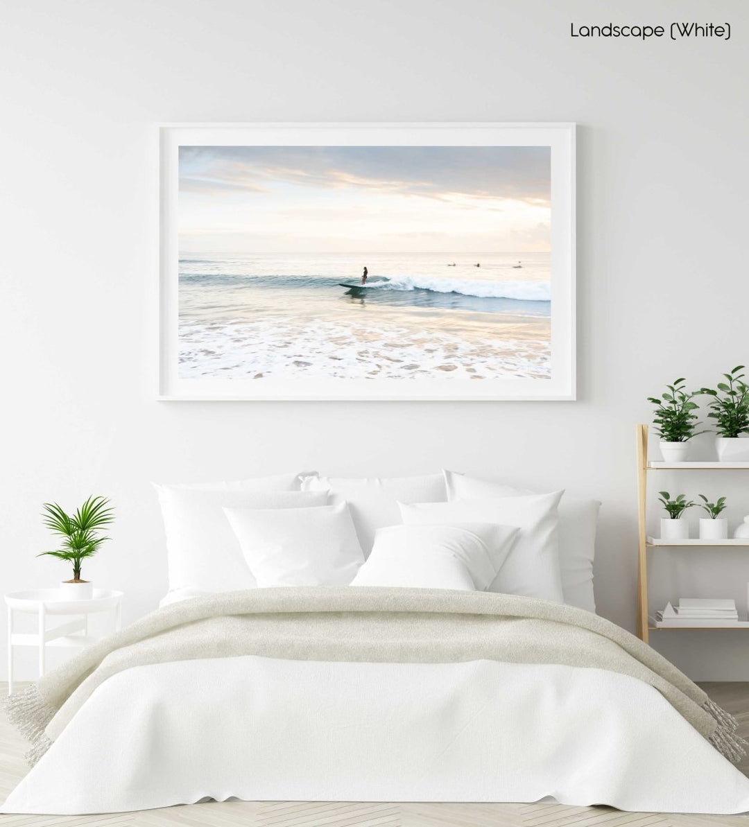 Girl surfing on a wave during sunrise on Manly Beach in Sydney in a white fine art frame