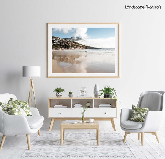 Surfer walking towards a kid on Llandudno Beach in Cape Town in a natural fine art frame