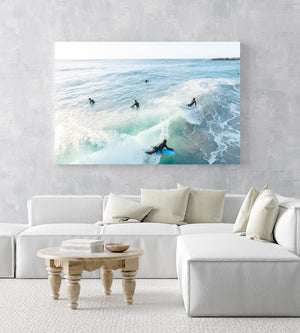 Aerial of bodyboarder surfing a wave amongst other surfers in Sandy Bay Cape Town in an acrylic/perspex frame