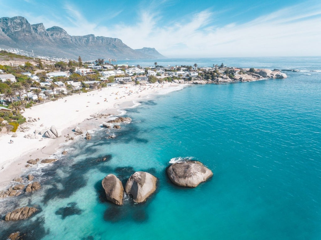 Aerial of Clifton Beach with blue water and sky on a summer day in Cape Town