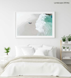 Aerial of a couple holding hands walking along Clifton Beach in Cape Town in a white fine art frame