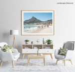 People swimming and playing on Camps Bay Beach below the lions head in a natural fine art frame