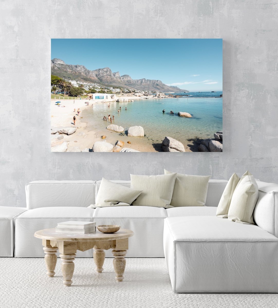 People swimming in the blue tidal pool in Camps Bay Cape Town in an acrylic/perspex frame