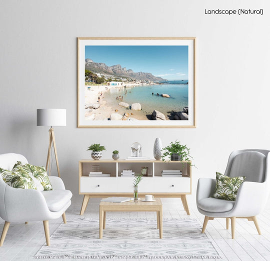 People swimming in the blue tidal pool in Camps Bay Cape Town in a natural fine art frame