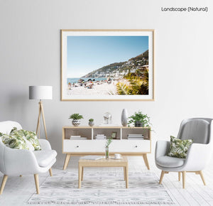 Palm tree and people sunbathing at Clifton fourth beach in Cape Town in a natural fine art frame