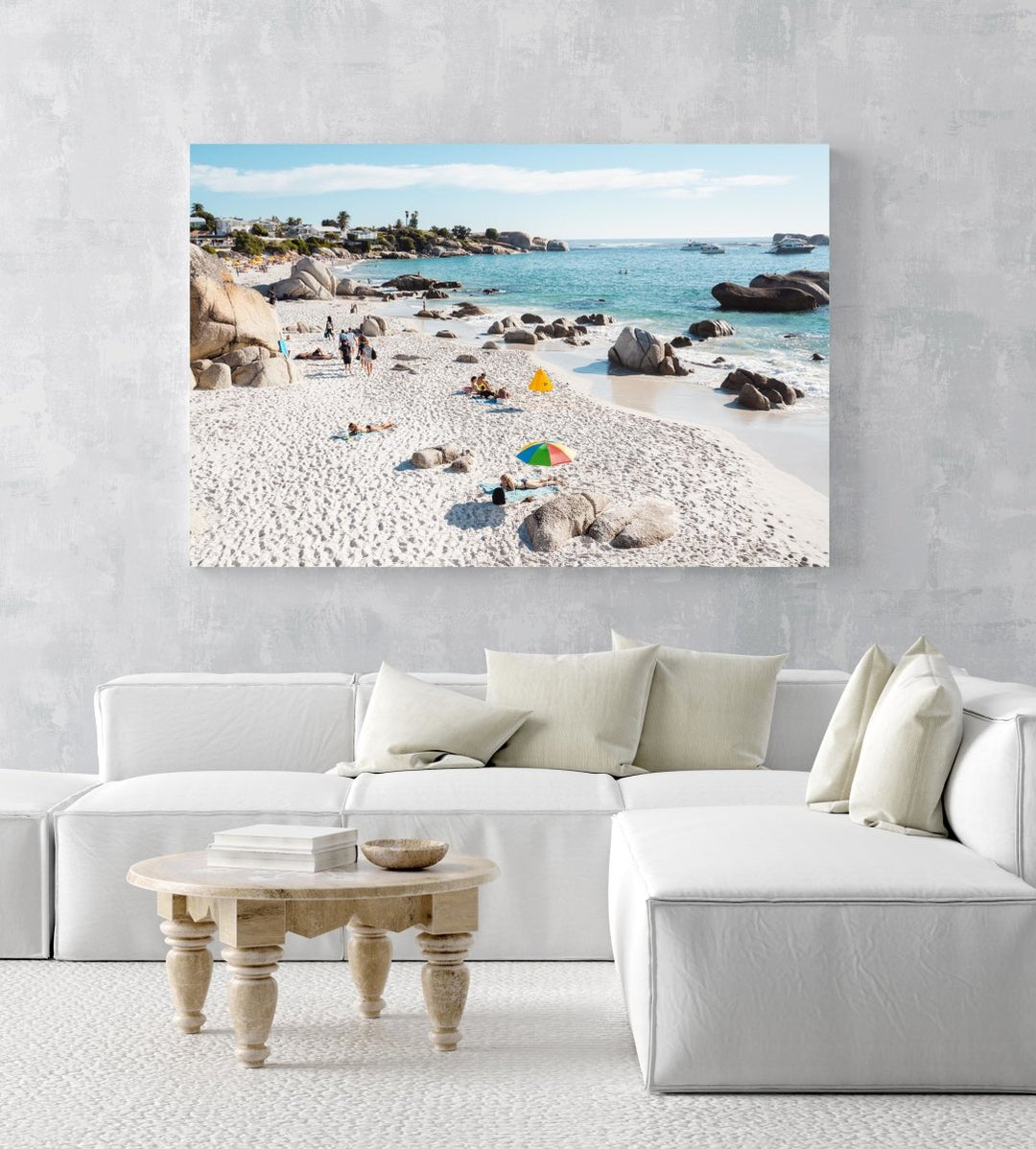 People tanning along the coast of Clifton in Cape Town in an acrylic/perspex frame