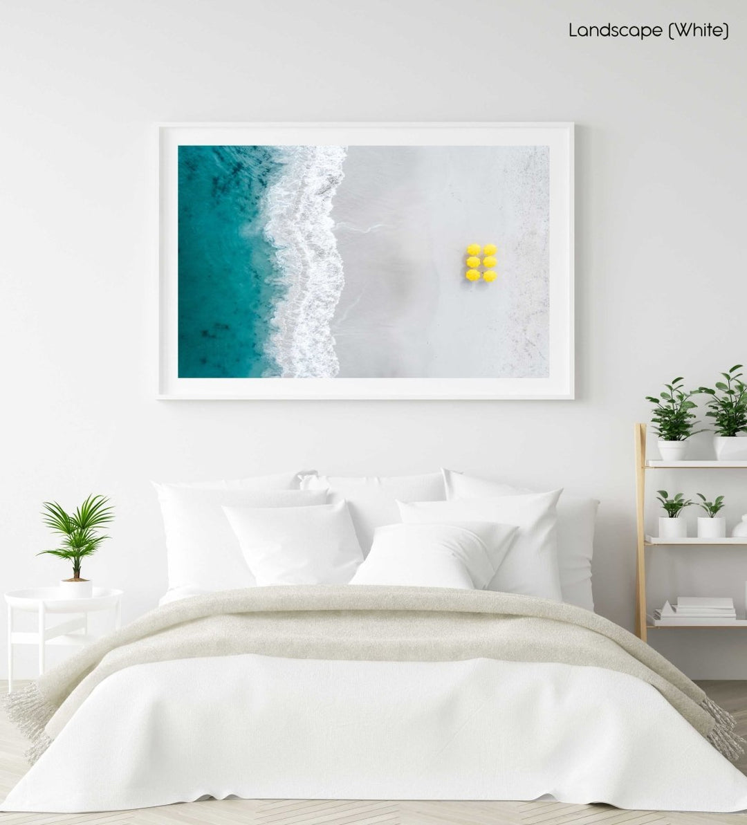 Aerial of six yellow umbrellas next to blue ocean on Camps Bay beach in Cape Town in a white fine art frame