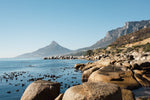Lions Head seen from Oudekraal's blue water and rocks