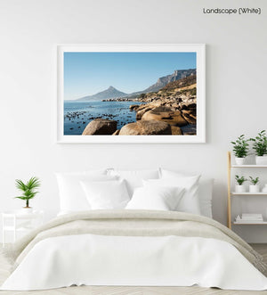 Lions Head seen from Oudekraal's blue water and rocks in a white fine art frame