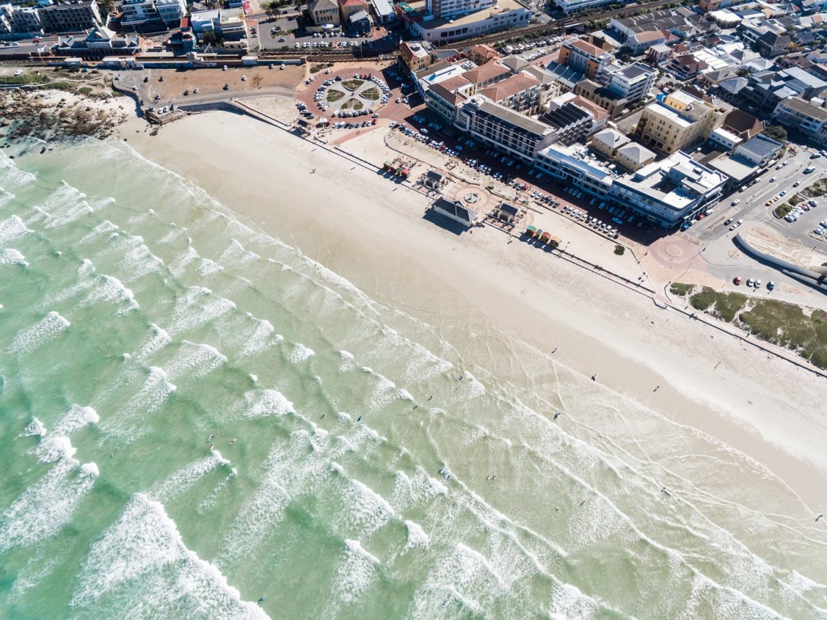 Aerial of Muizenberg beach and its waves in Cape Town