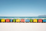 A row of colorful huts along Muizenberg Beach