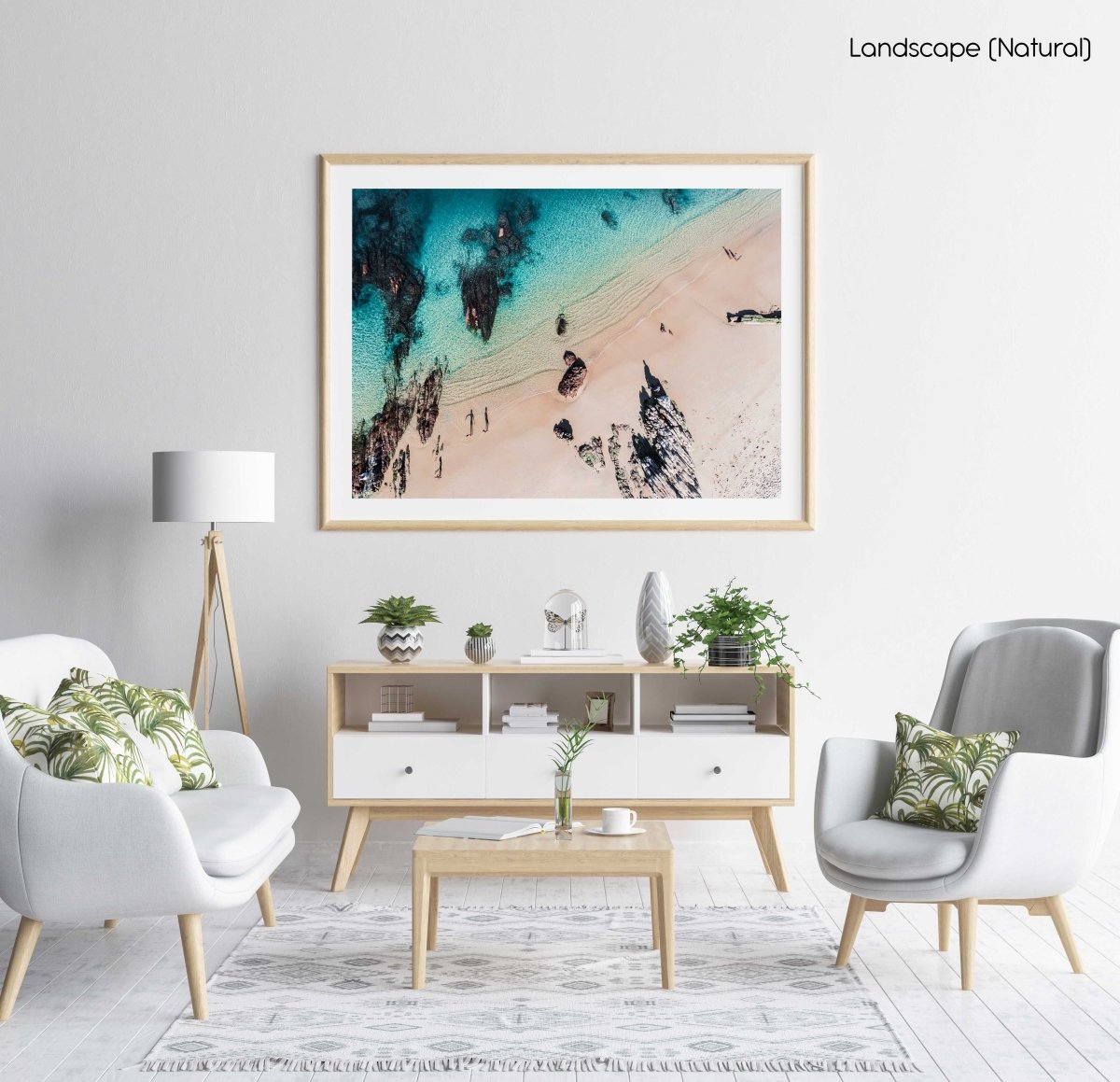 Aerial of kids playing on a beach in Kalk Bay in a natural fine art frame